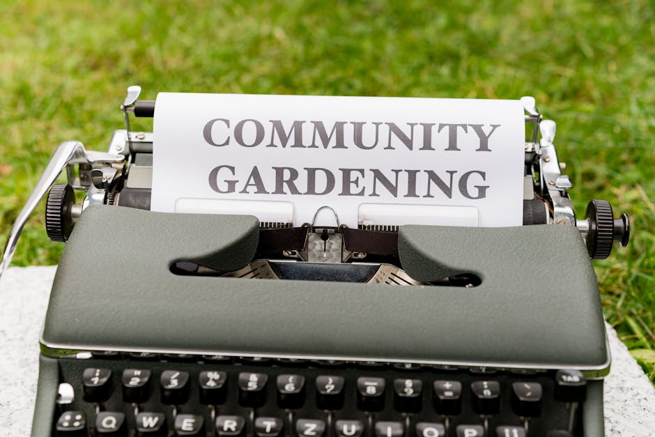 A row of purple plastic bags filled with garden waste, tied with red string, sit on a grassy lawn next to a hedge on the left. The background features a lush green hedge, trees, and a residential hous